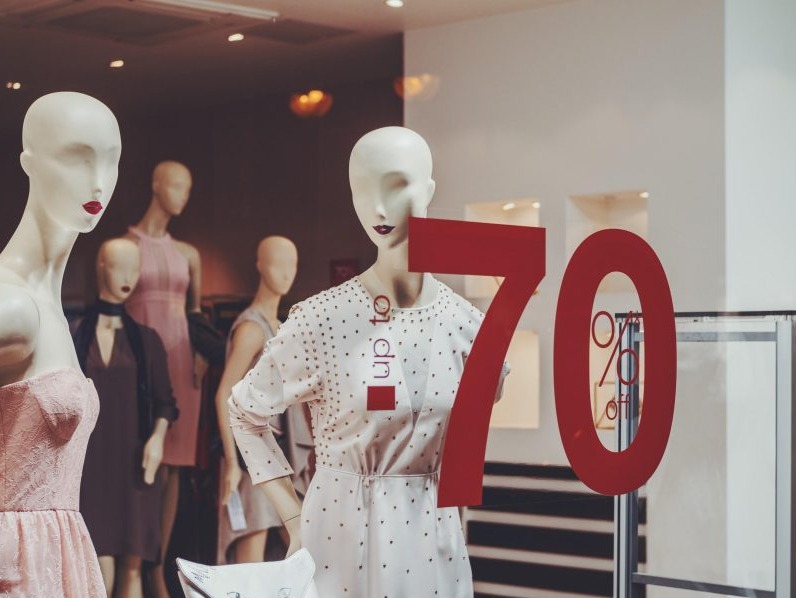 A store window displaying woman dresses