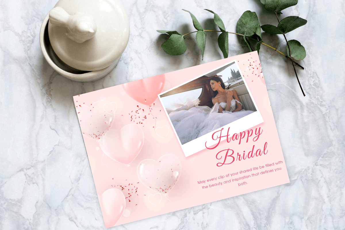 Pink bridal shower card on a desk