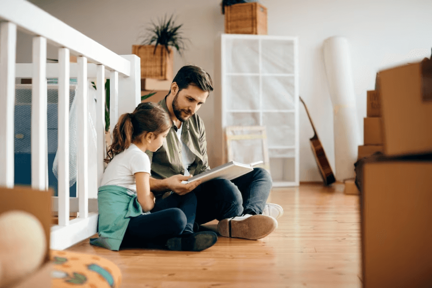 A father is reading with his daughter