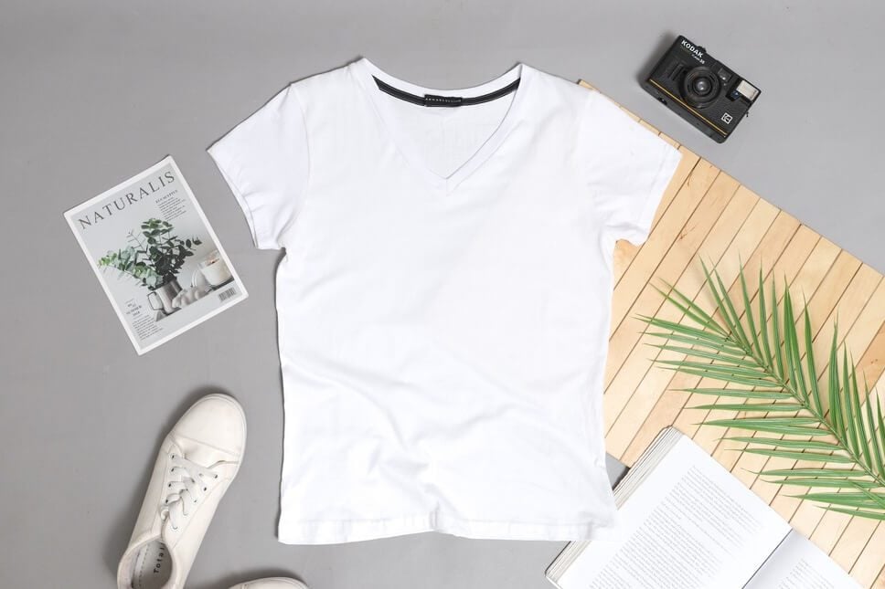 A flat lay shot of a white t-shirt