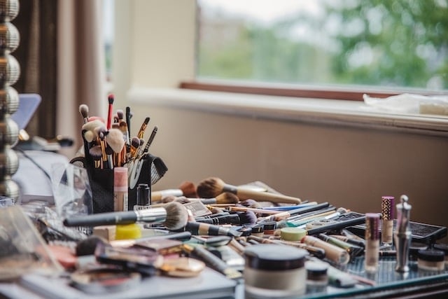 A lot of makeup is on the table