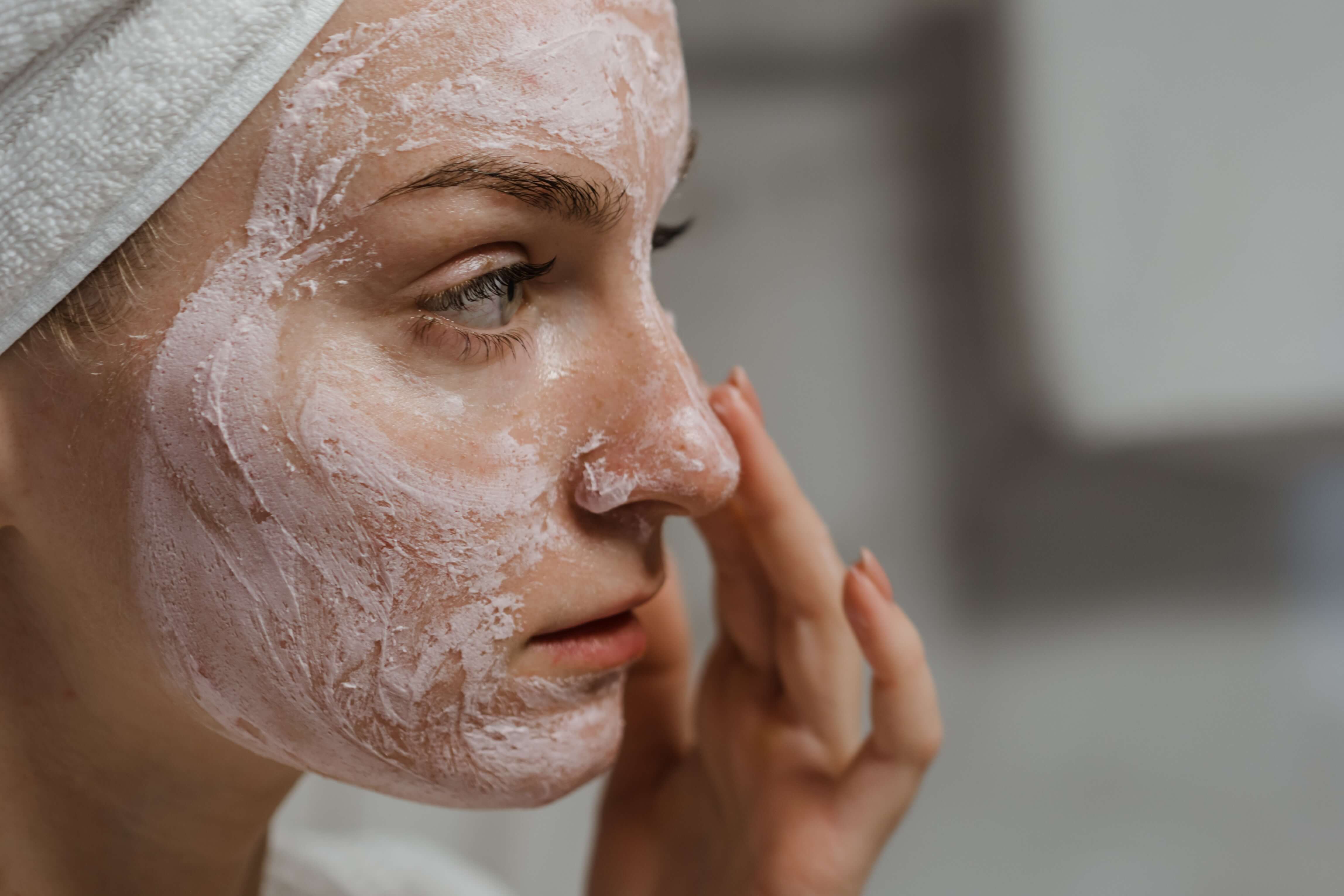 A woman is doing skincare