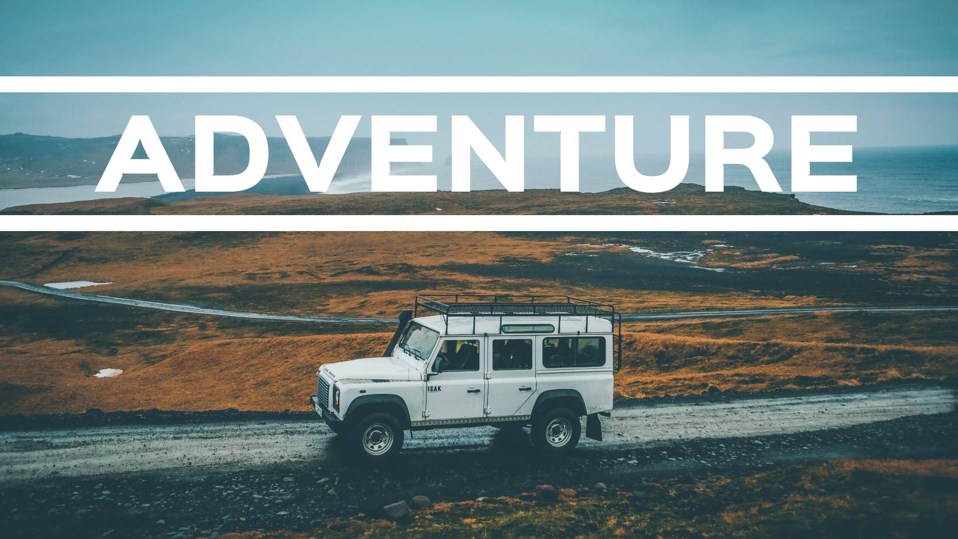 a white car on the road with adventure banner
