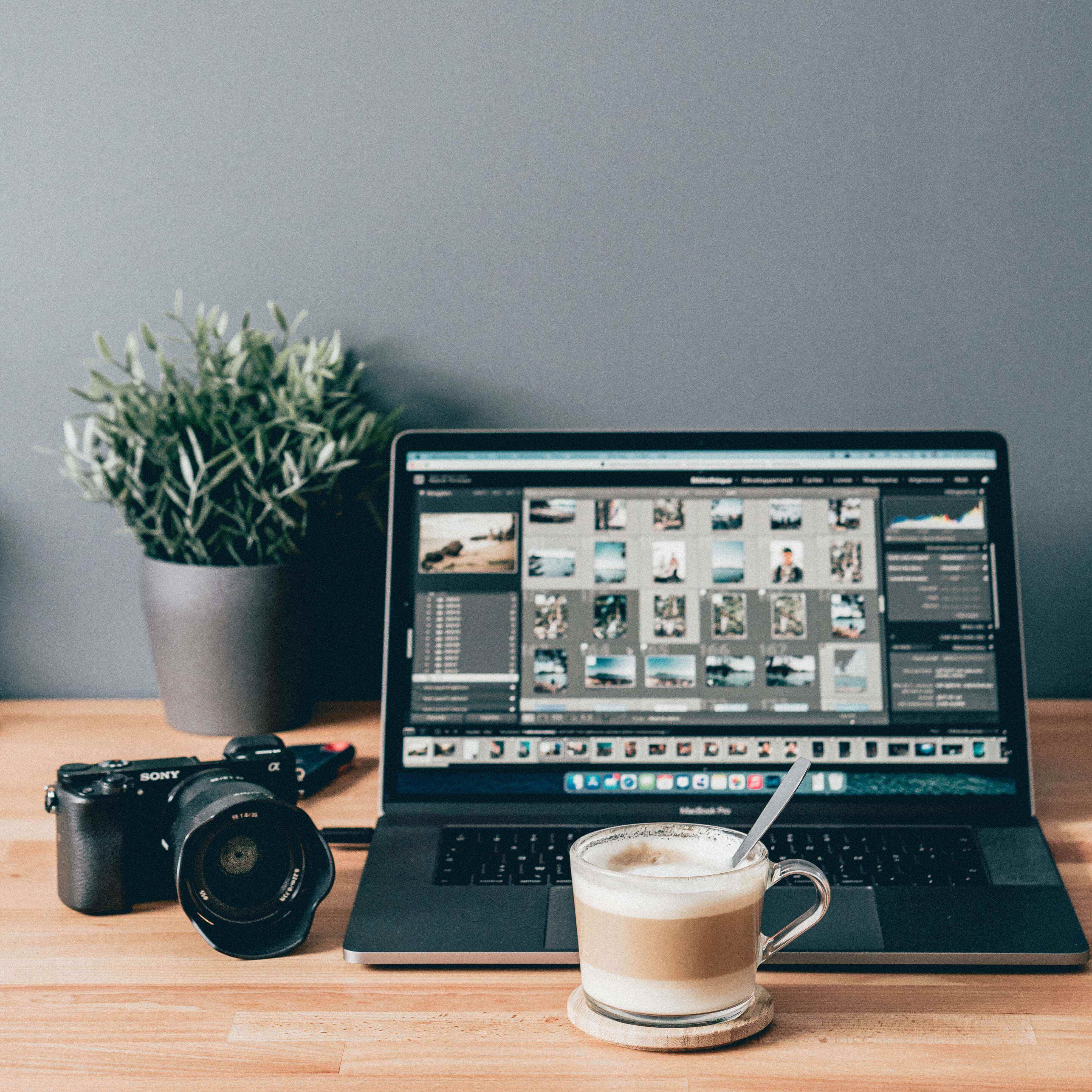 a computer on the desk doing photo editing