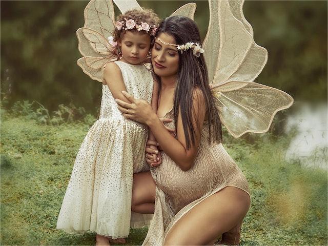 Pregnant women and little girls dressed in fairy costumes
