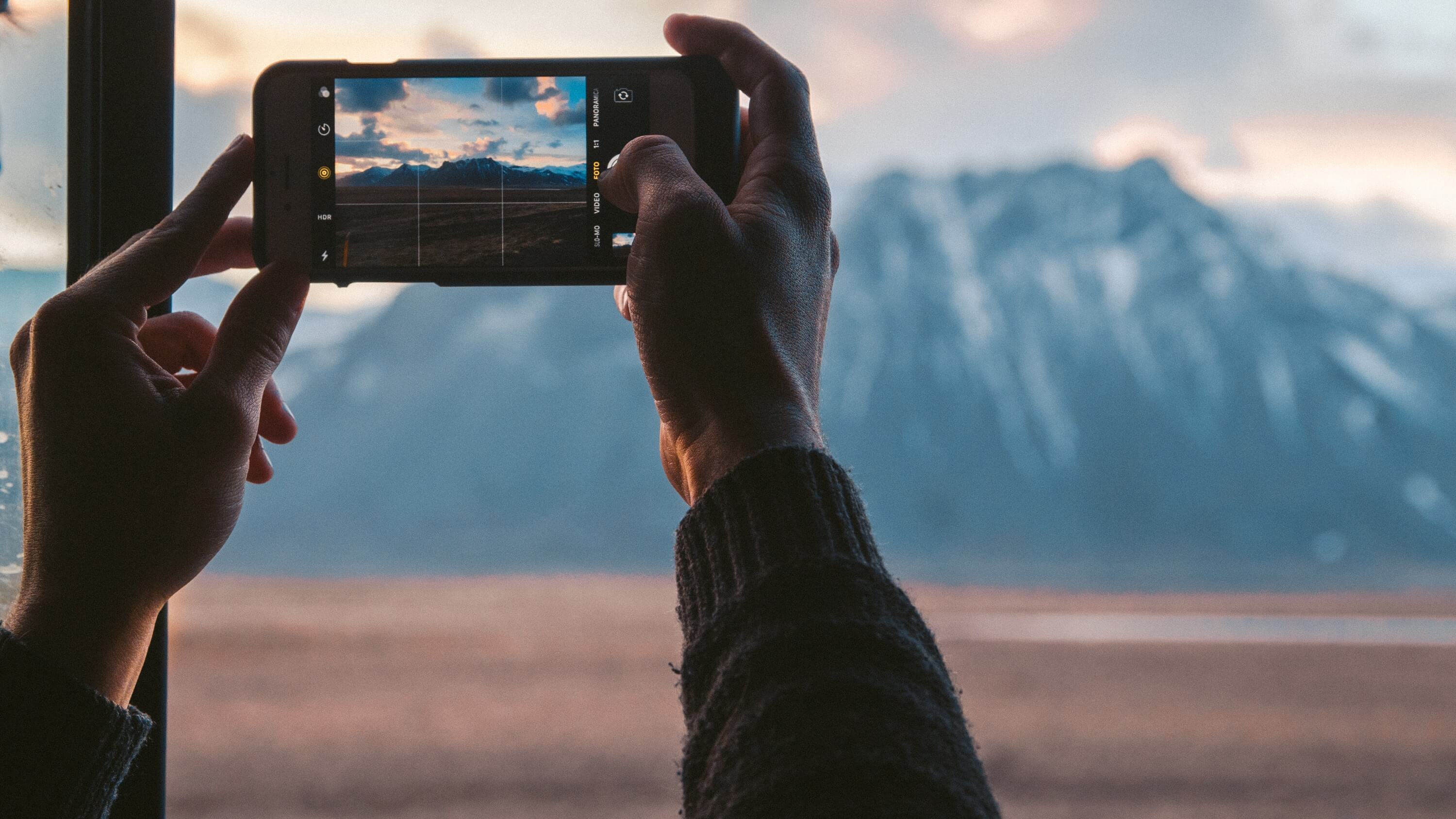 Using cell phone camera to take picture of a mountain