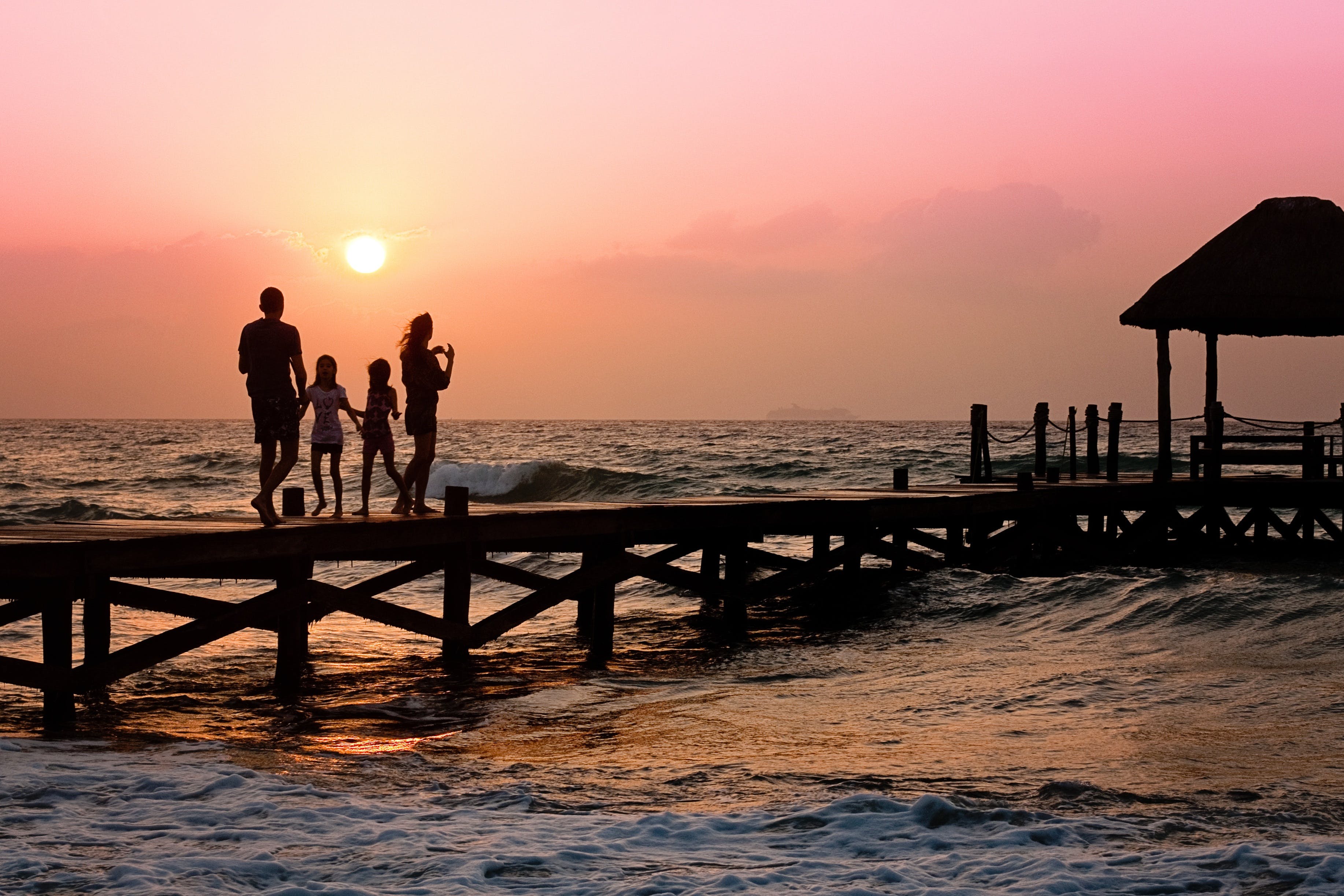 a beach sunset photo of a family