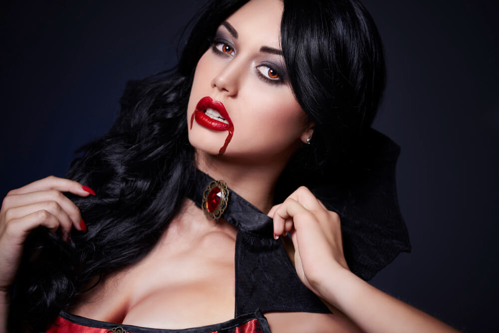 a beautiful woman with gothic vampire makeup look
