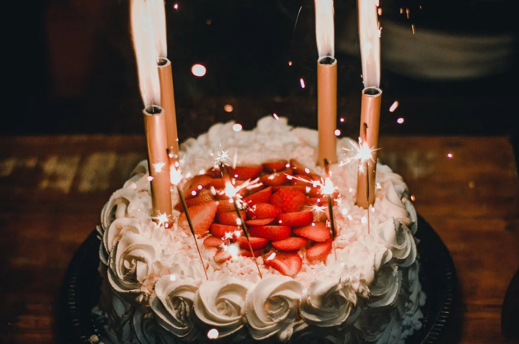 a birthday cake with many candles