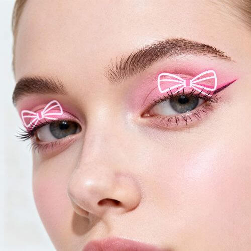 a girl with gift wrap bow eyeliner look