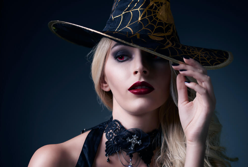 a gothic beautiful woman with a witch hat