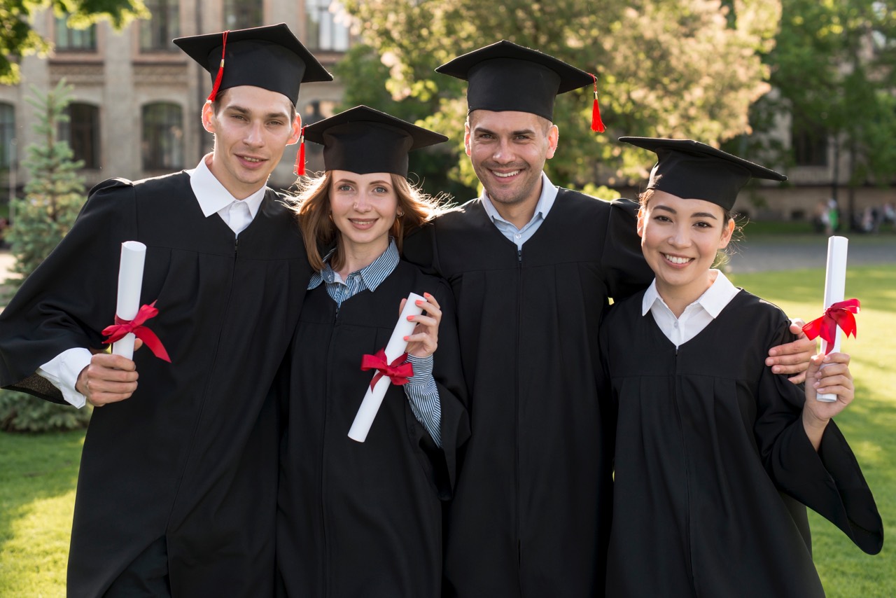 a graduation photo of four people