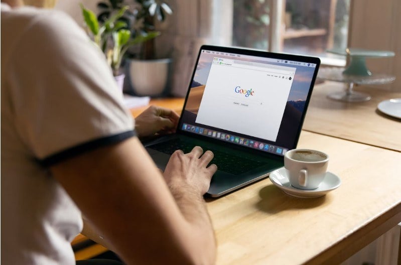 Women using Google search on laptop