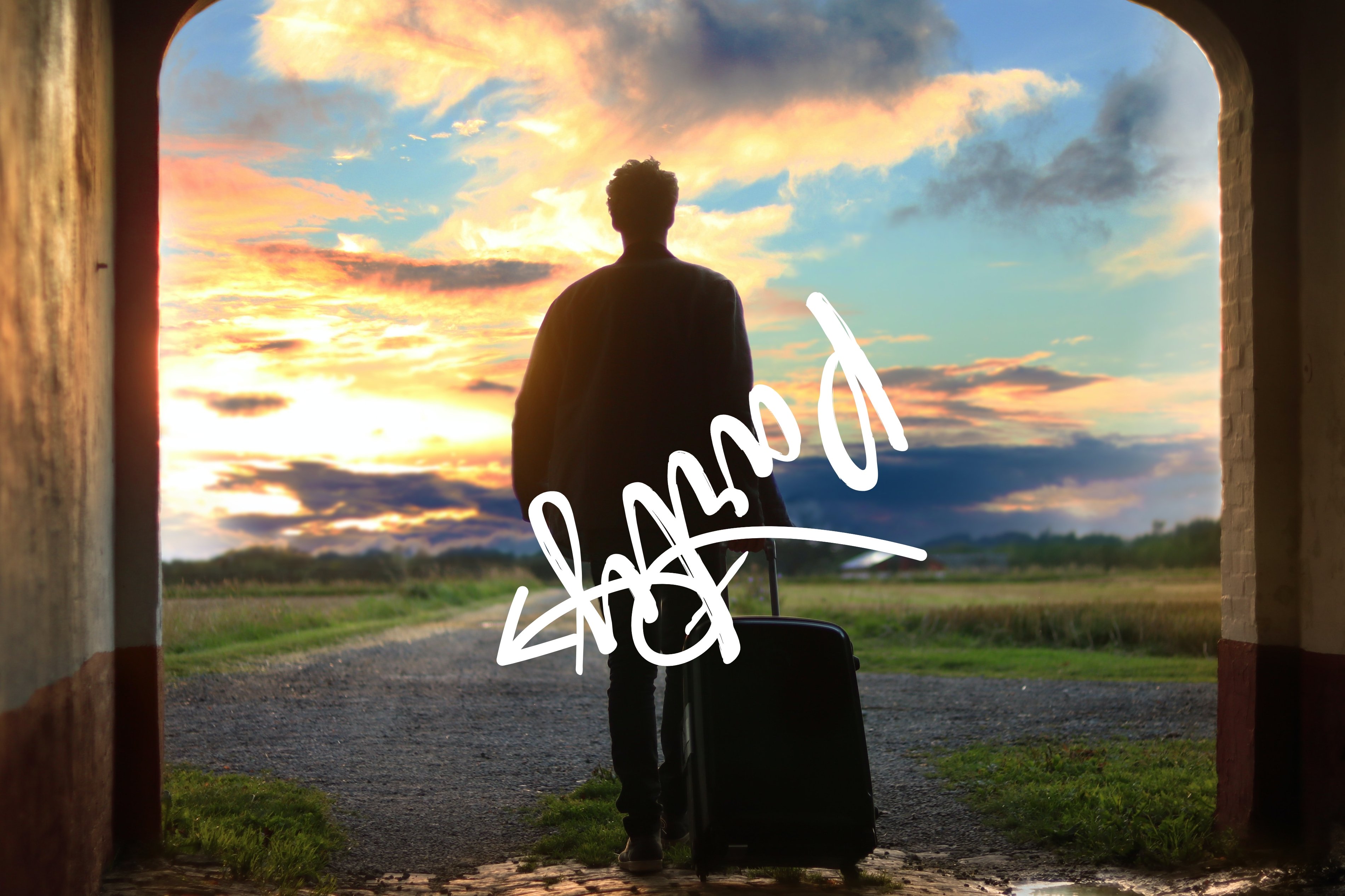 a man taking a luggage with beautiful sky in front and unwanted drawing on the cover