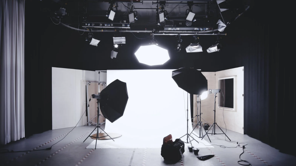 a product photographing studio with white background and many settings