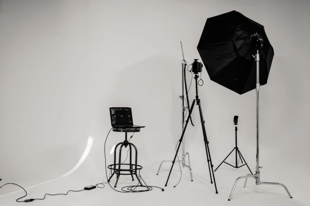 a set of studio settings including tripods, camera, computer, and much more