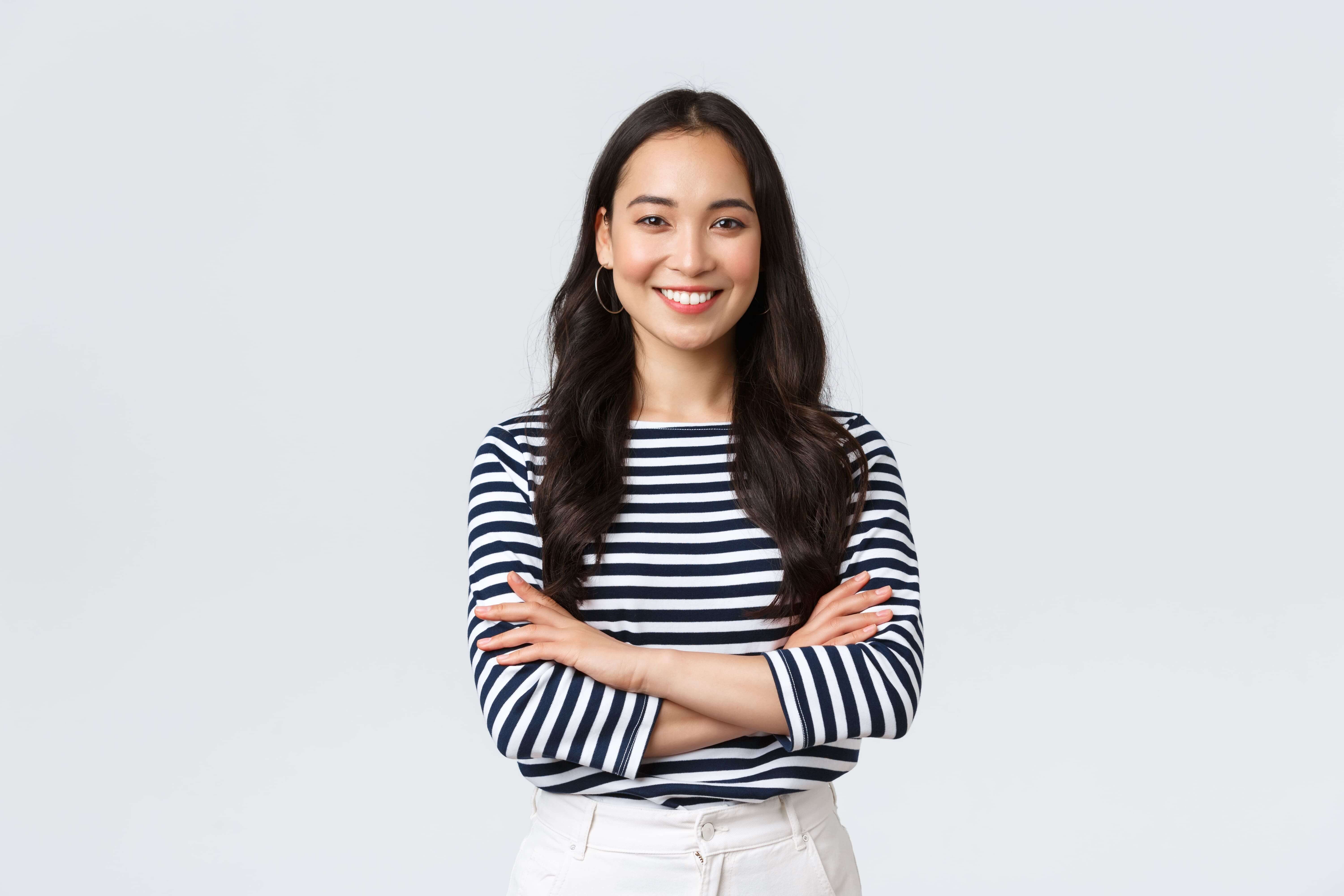 a smiling woman in striped shirt