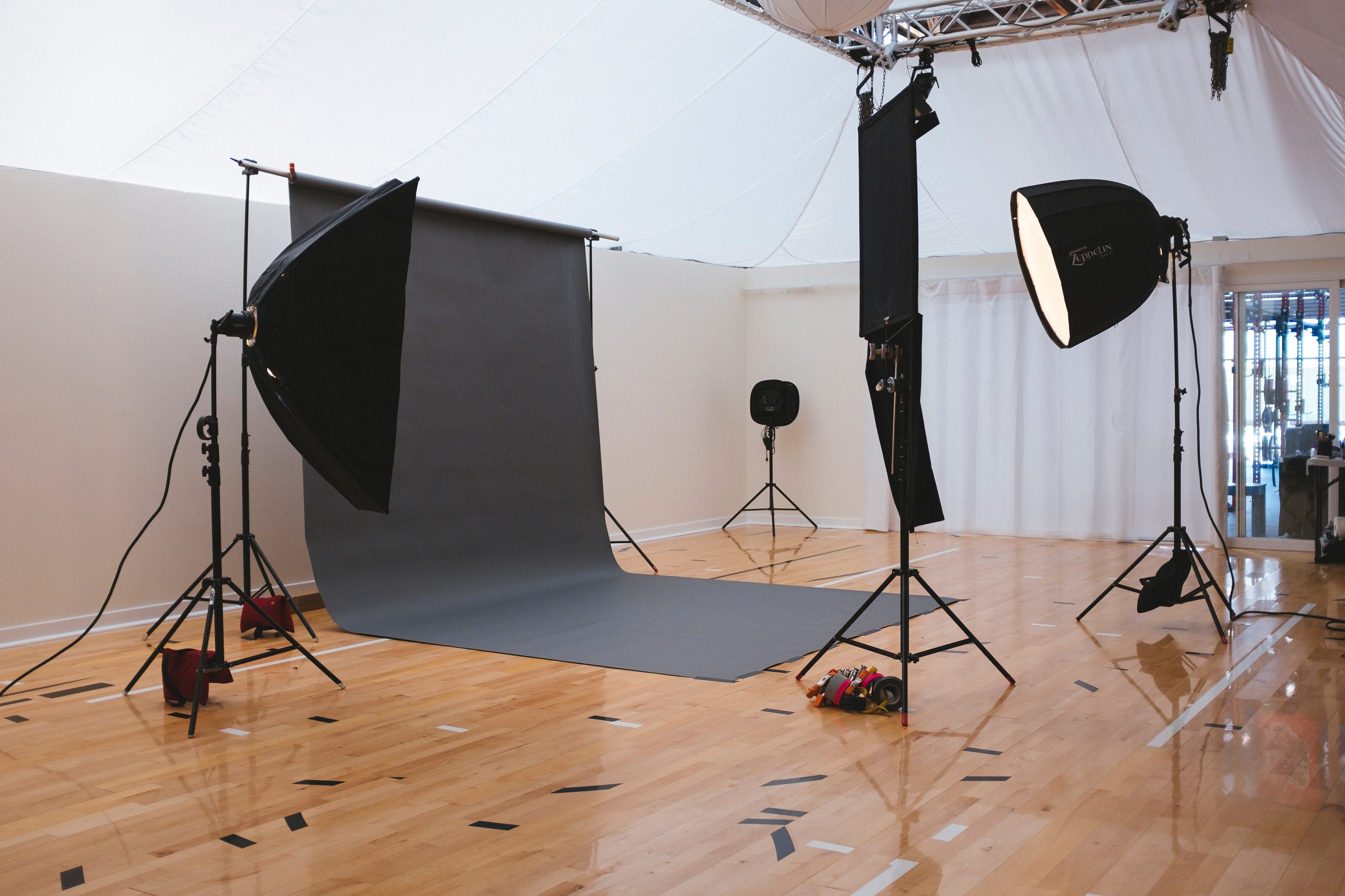 a studio with black backdrop and light
