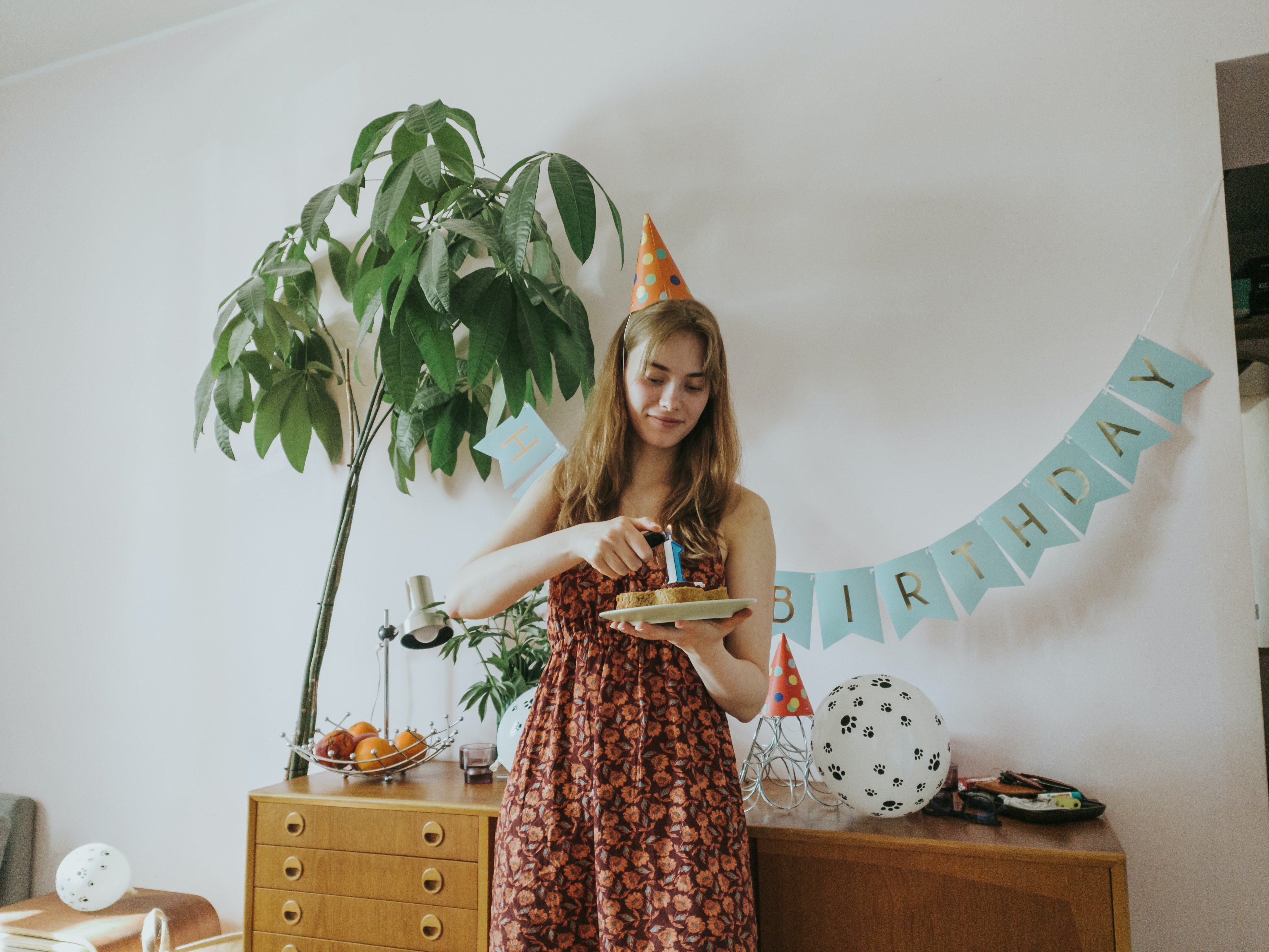 a woman lighting candles at home