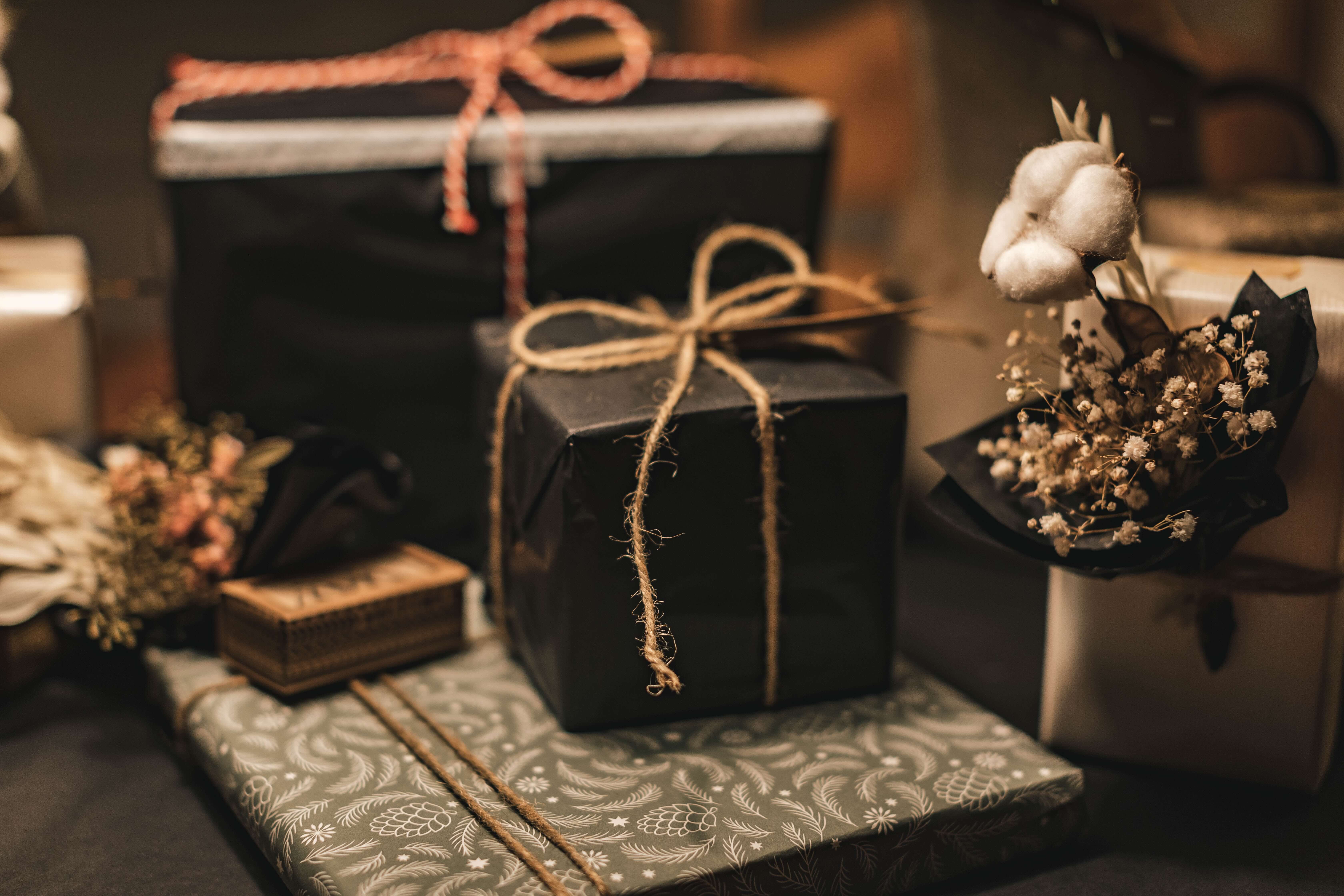 Black gift boxes and a bouquet