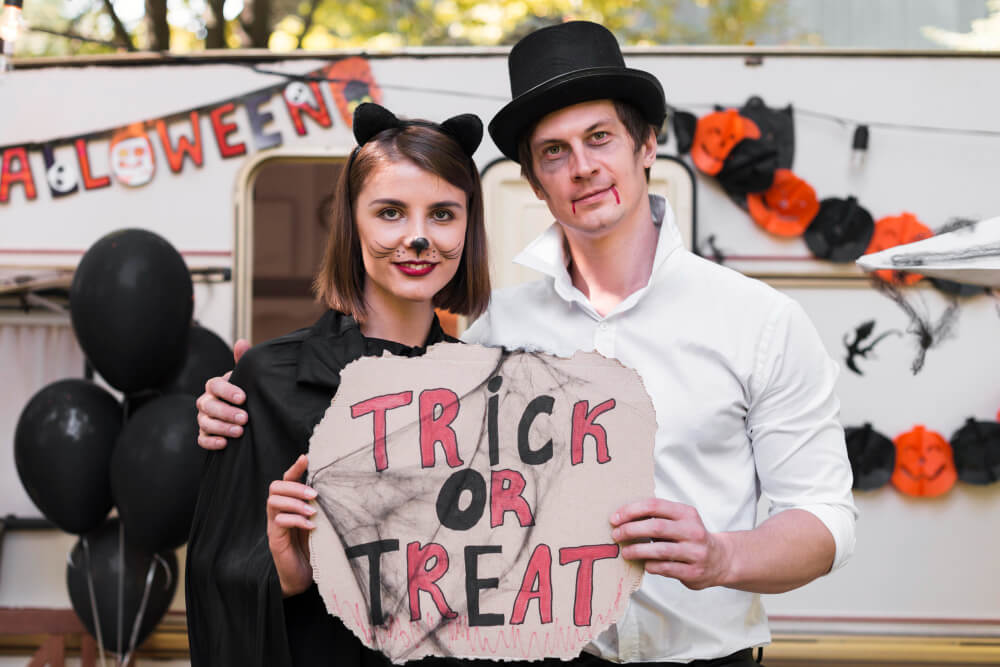 couple Halloween costumes of a vampire and a mickey mouse