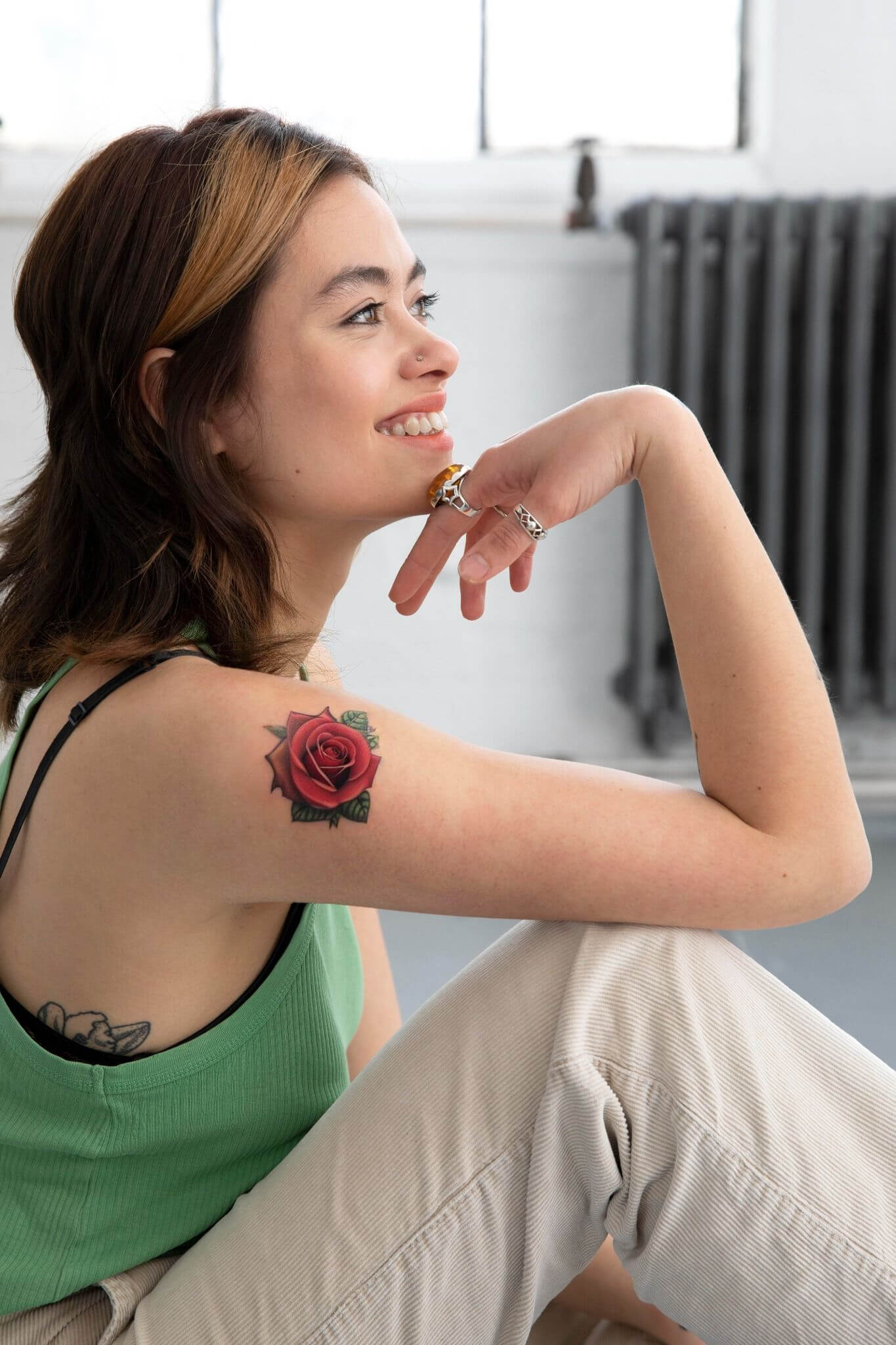 cover up a rose tattoo on woman's arm