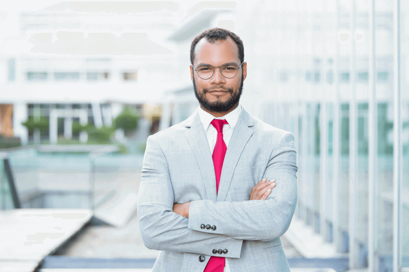 A business man crosses arms with smile