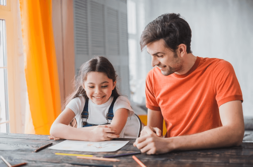 father and daughter are reading a book