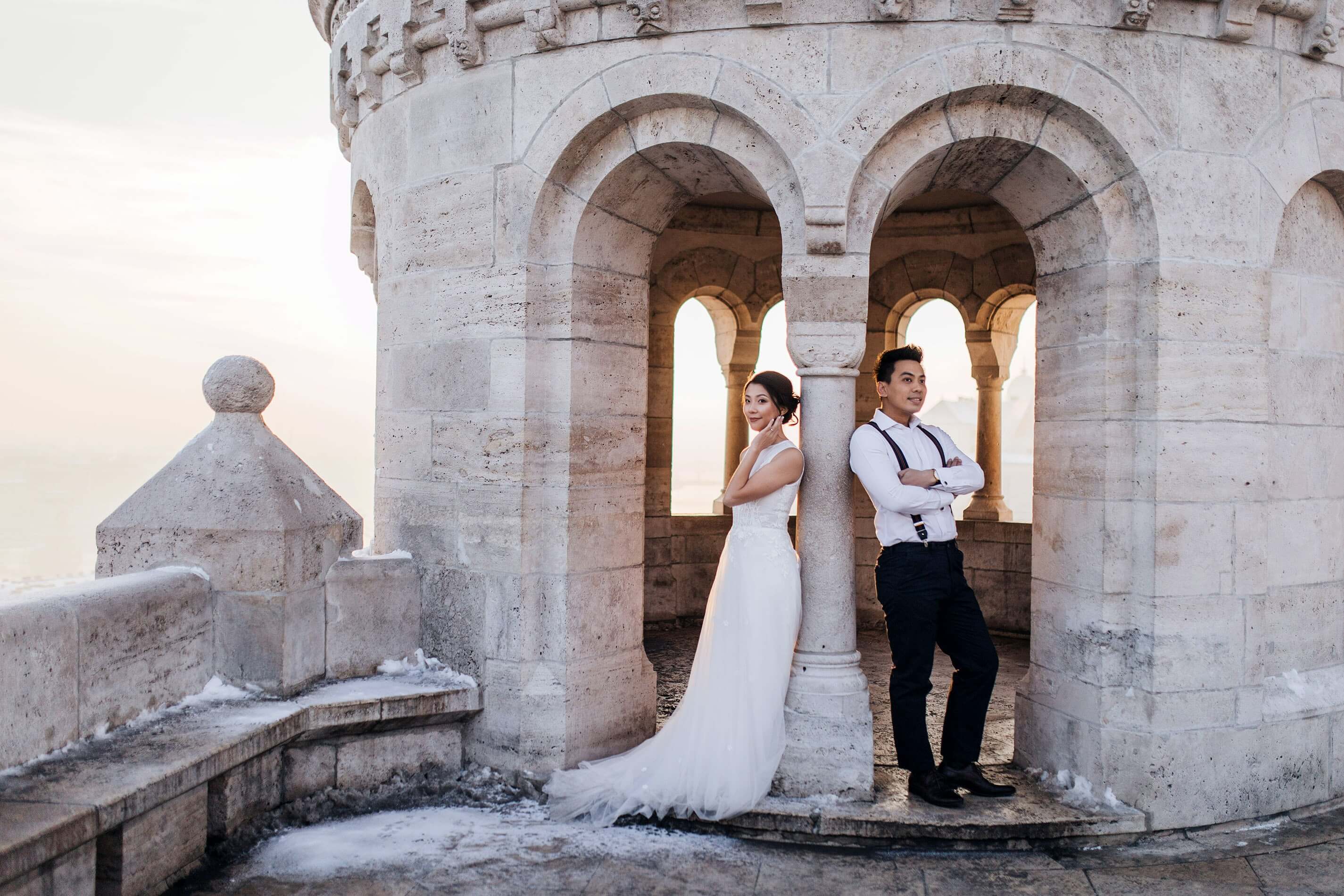 husband and wife are back against the wall on wedding