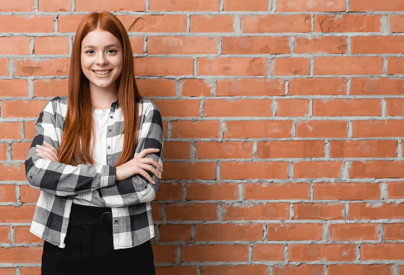 A young girl leans against the wall