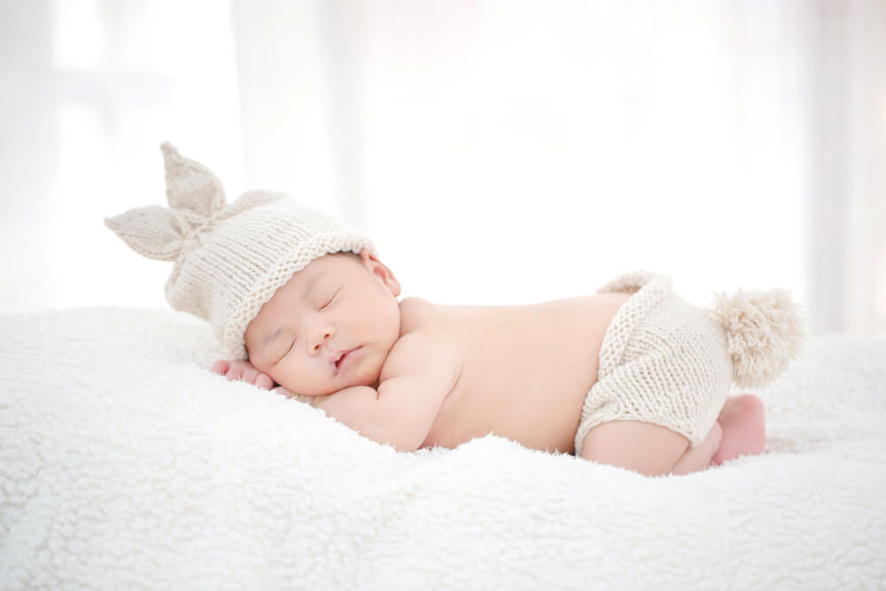 lovely newborn baby sleeping furry cloth