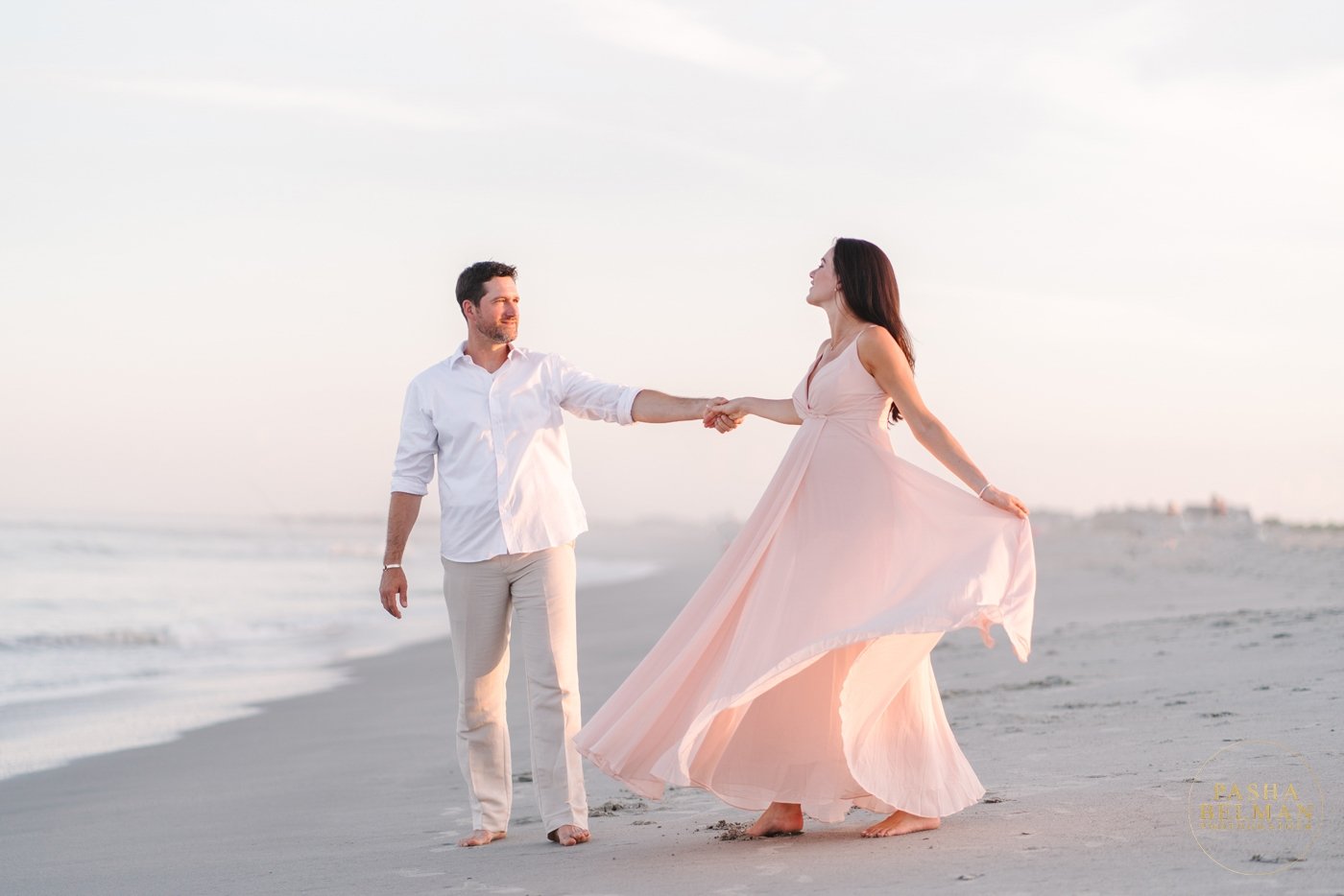 maternity photo with husband on the beach