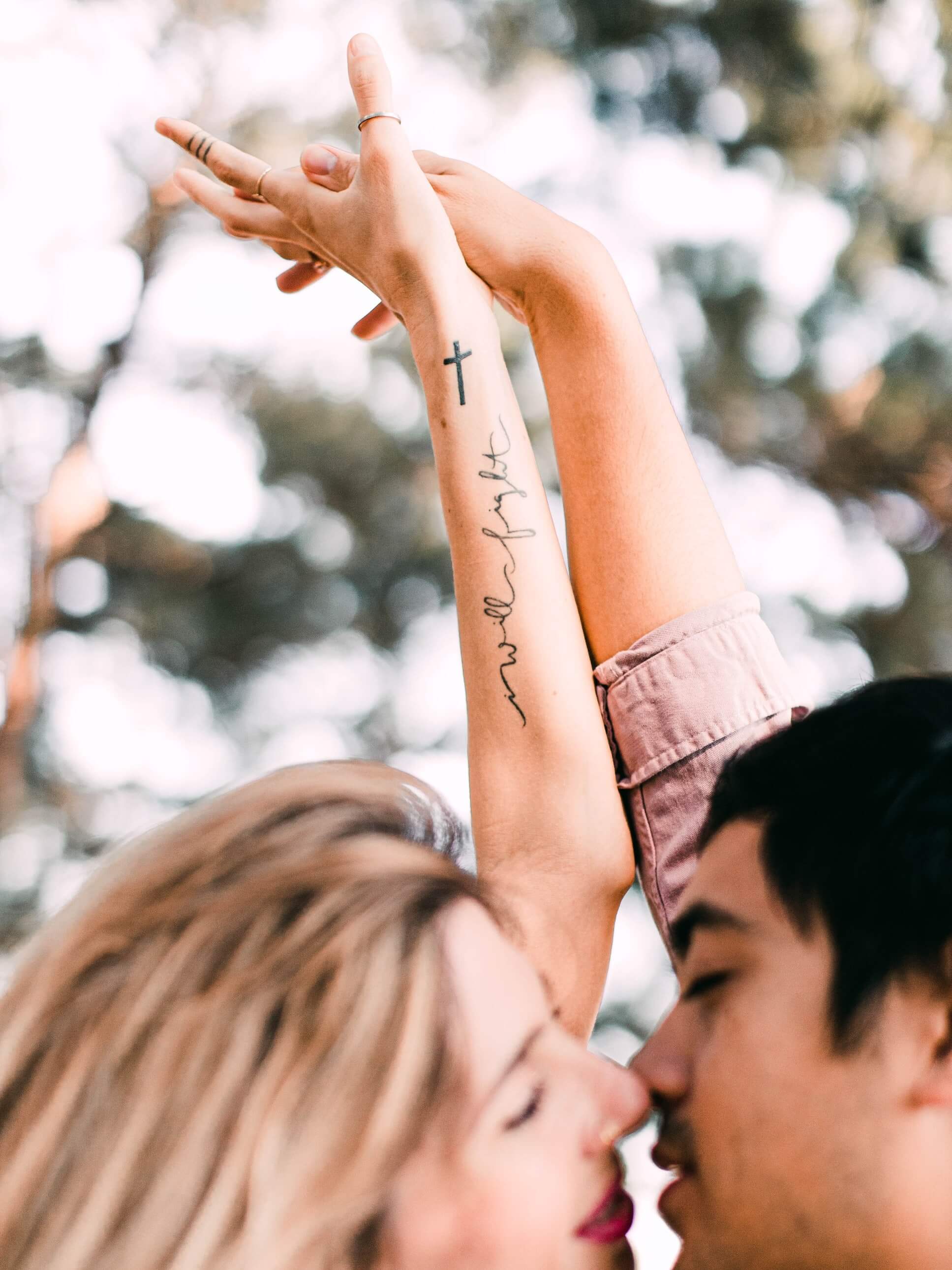 name tattoo on woman's forearm