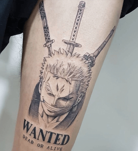 one piece character wanted arm tattoo