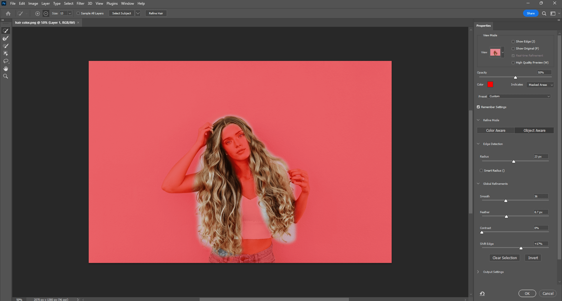 Use Photoshop to create a mask of the hair