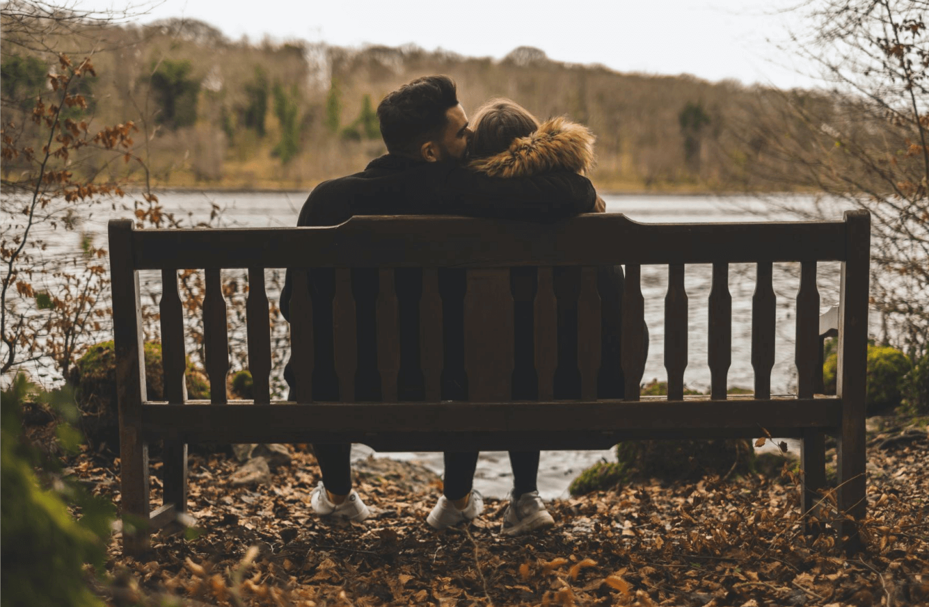 the couple sit on the bench