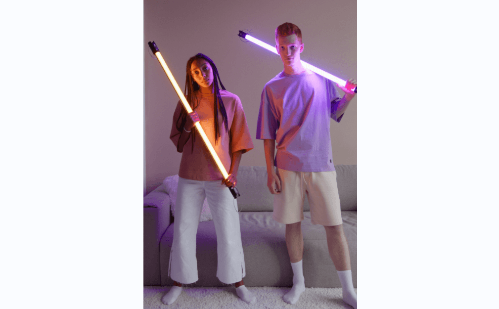 the young couple hold the glow stick