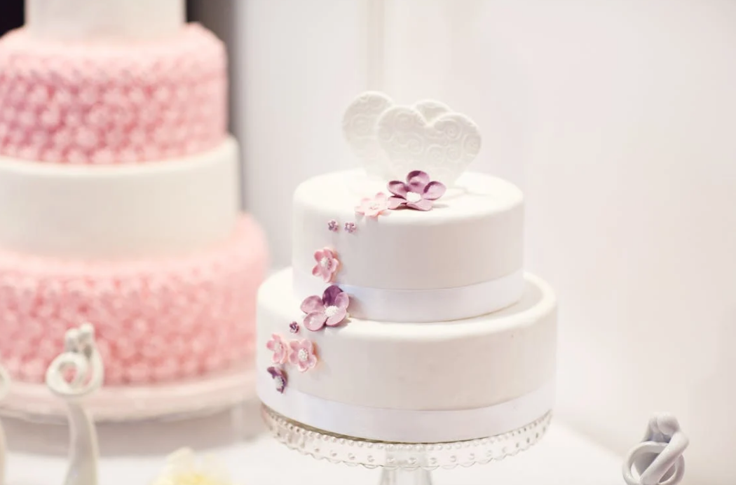 two birthday cakes with some decorations