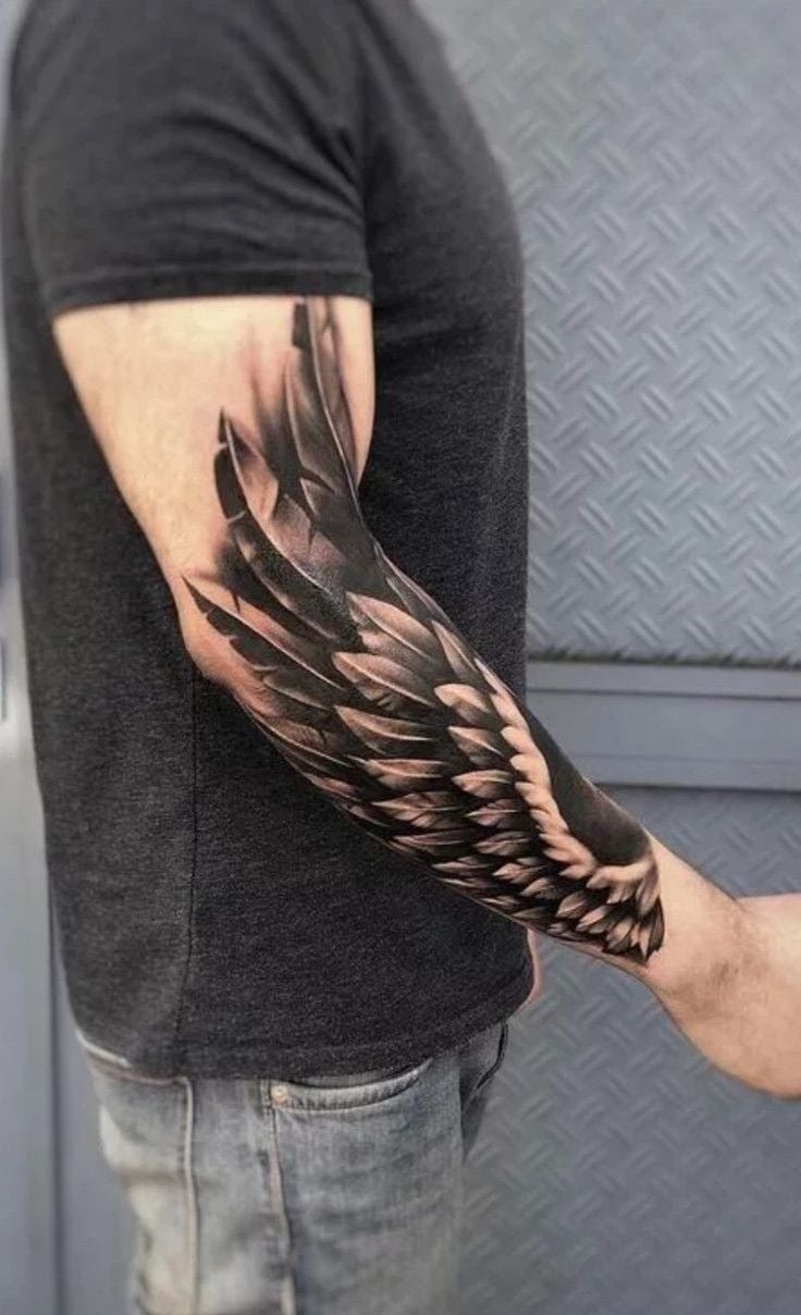 wings tattoo on arm