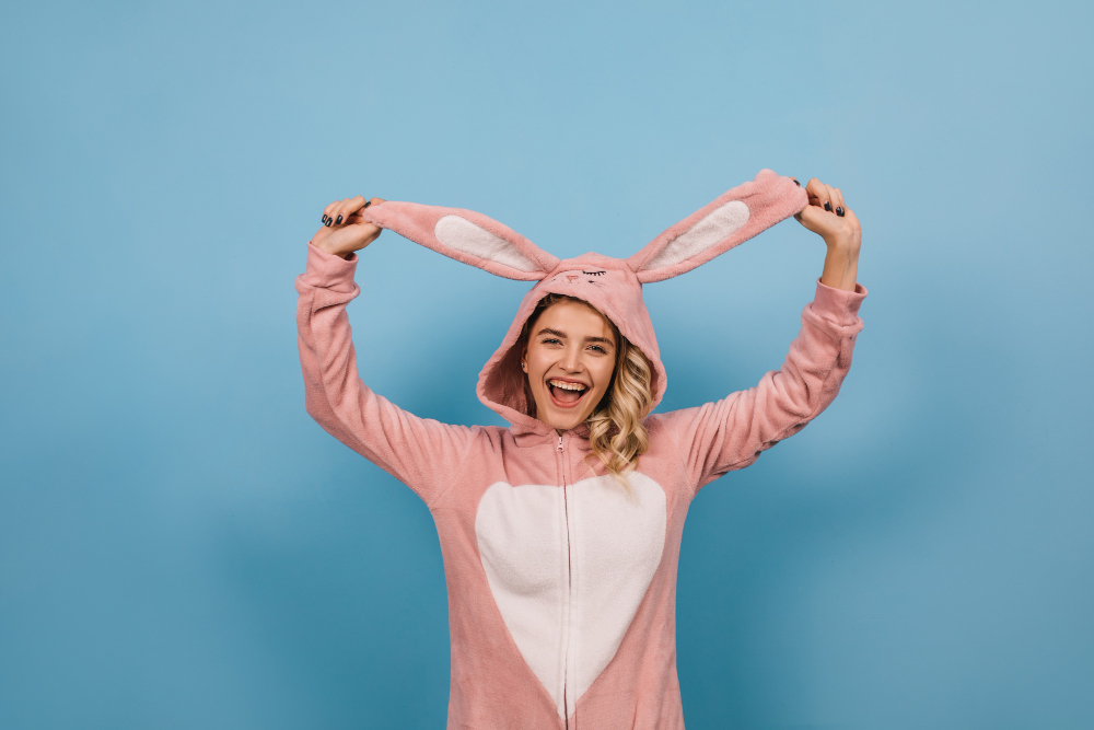 woman rabbit costume holding ears