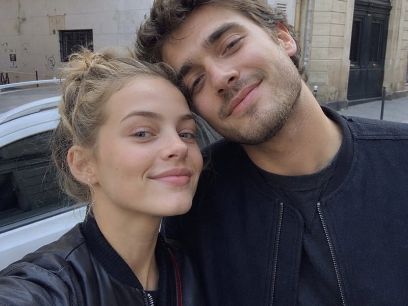 A closeup selfie of a young couple on a city street generated by Fotor AI couple photo maker free online