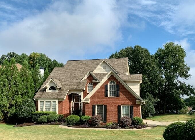 House image with blue sky and clean background replacement for listing presentation
