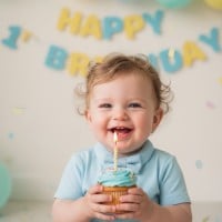 Thumbnail image featuring a happy baby with a tiny cake