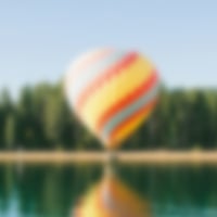 A low quality thumbnail of a hot air balloon by the lake