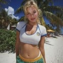 A thumbnail of a woman on the beach showing her midriff