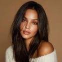 An thumbnail of a woman with black straight hair