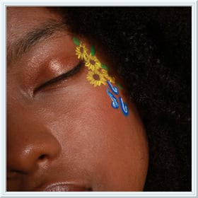 Add a classy frame to a photo of a girl with graffiti on her face