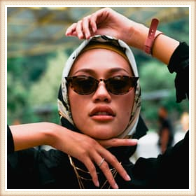 Add a classy frame to the photo of the handsome girl wearing sunglasses