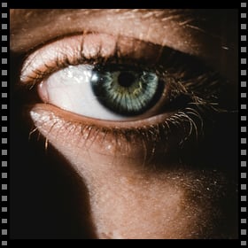 Add a film edge frame to a photo with a single beautiful eye