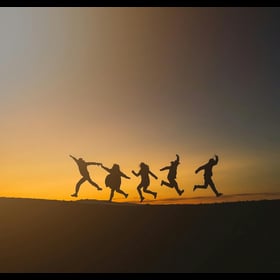 Add a film edge frames to a photo of five people posing for a picture